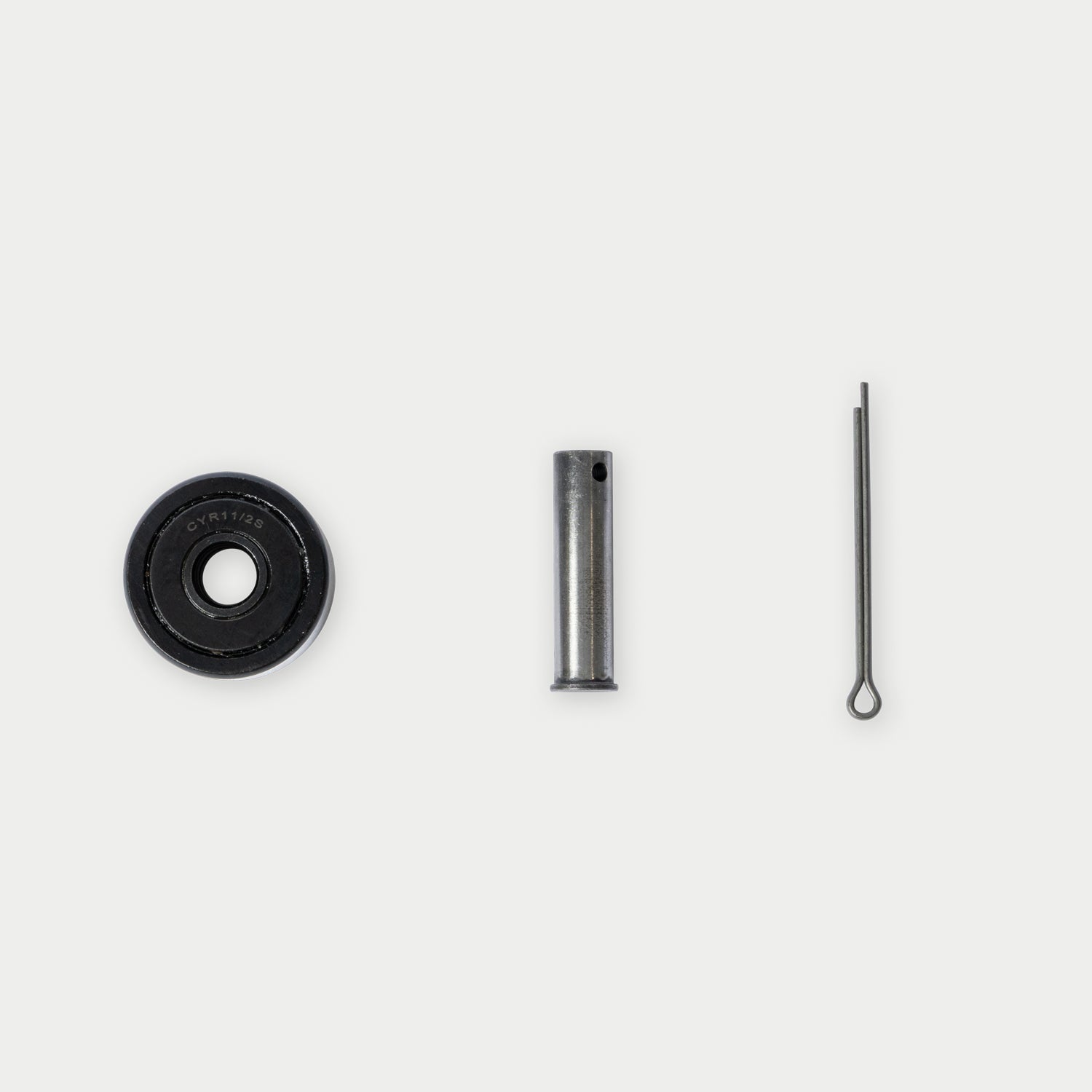 [RCG001] CargoGlide bearing, axle, and clevis pin on light grey background.