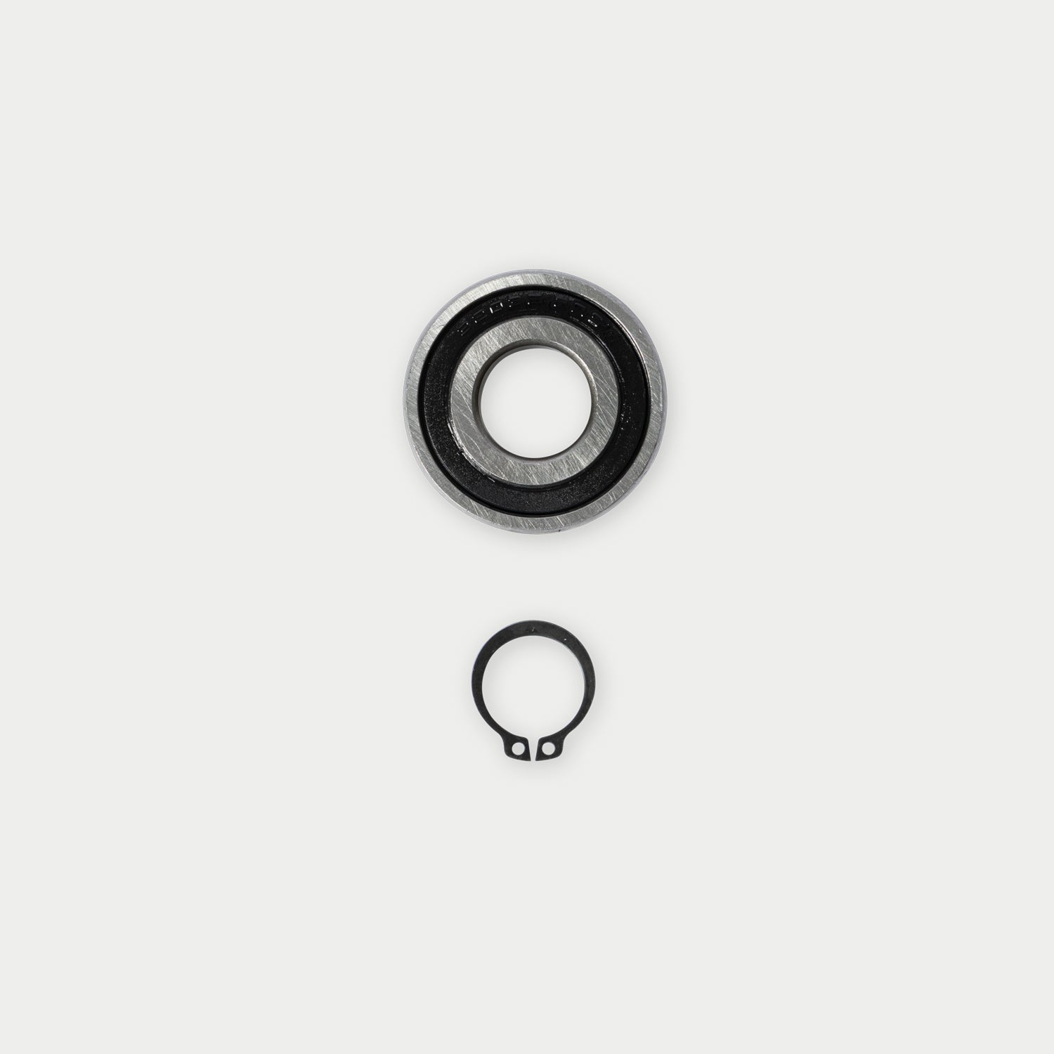 CargoGlide bearing, axle, and c-clip on light grey background.