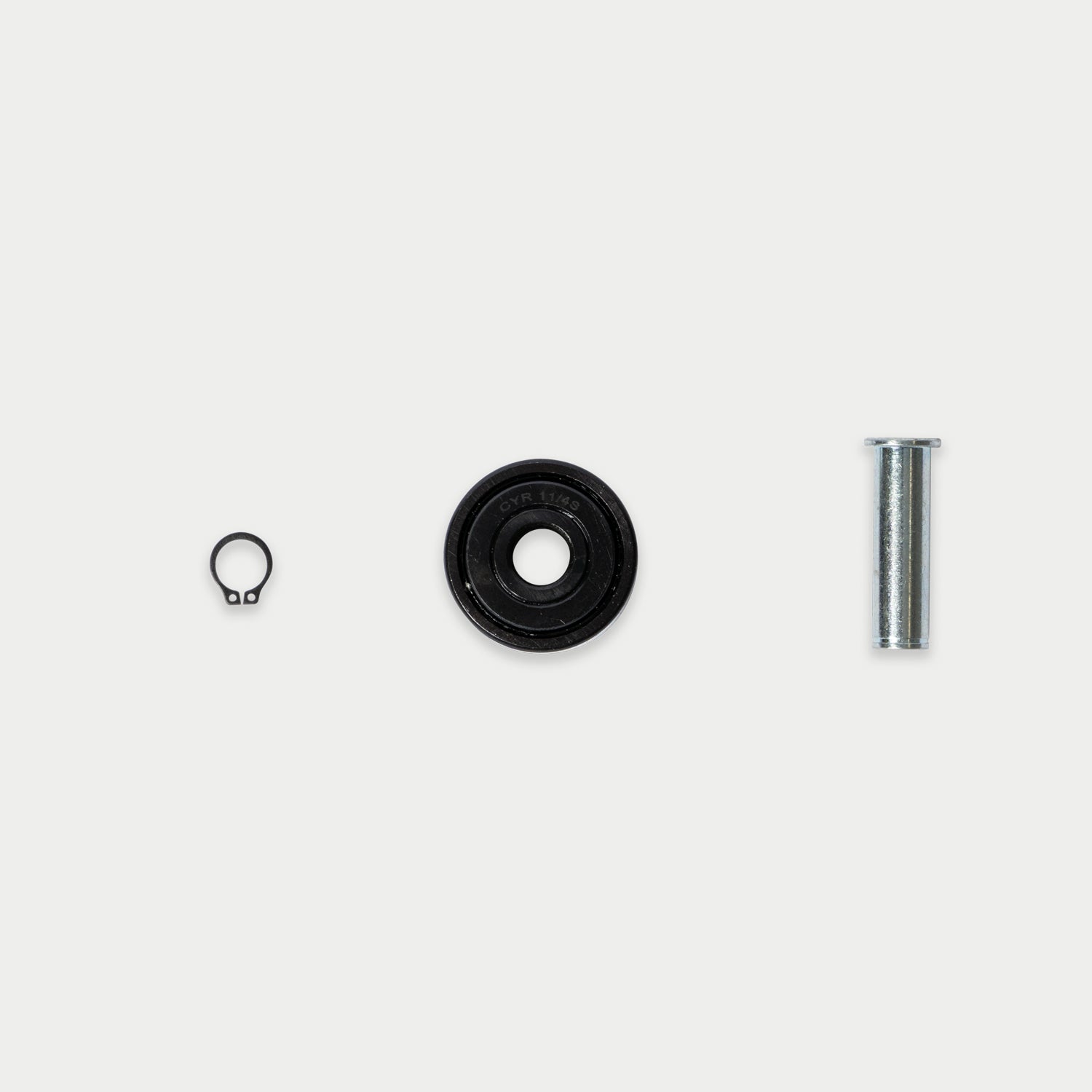 [RCG003] CargoGlide bearing, axle, and c-clip on light grey background.