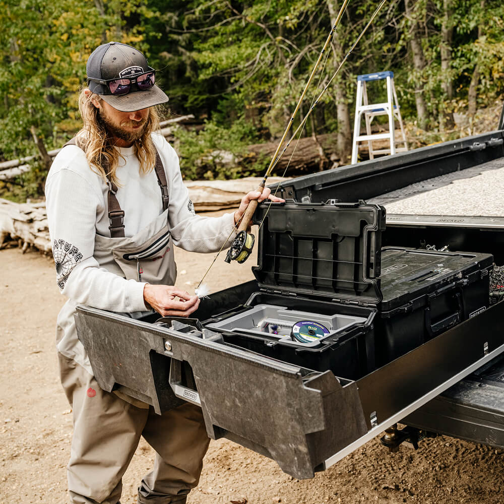 DECKED ambassador, David Gravette, retrieving his fishing gear from his Black Sixer inside of his Drawer System.