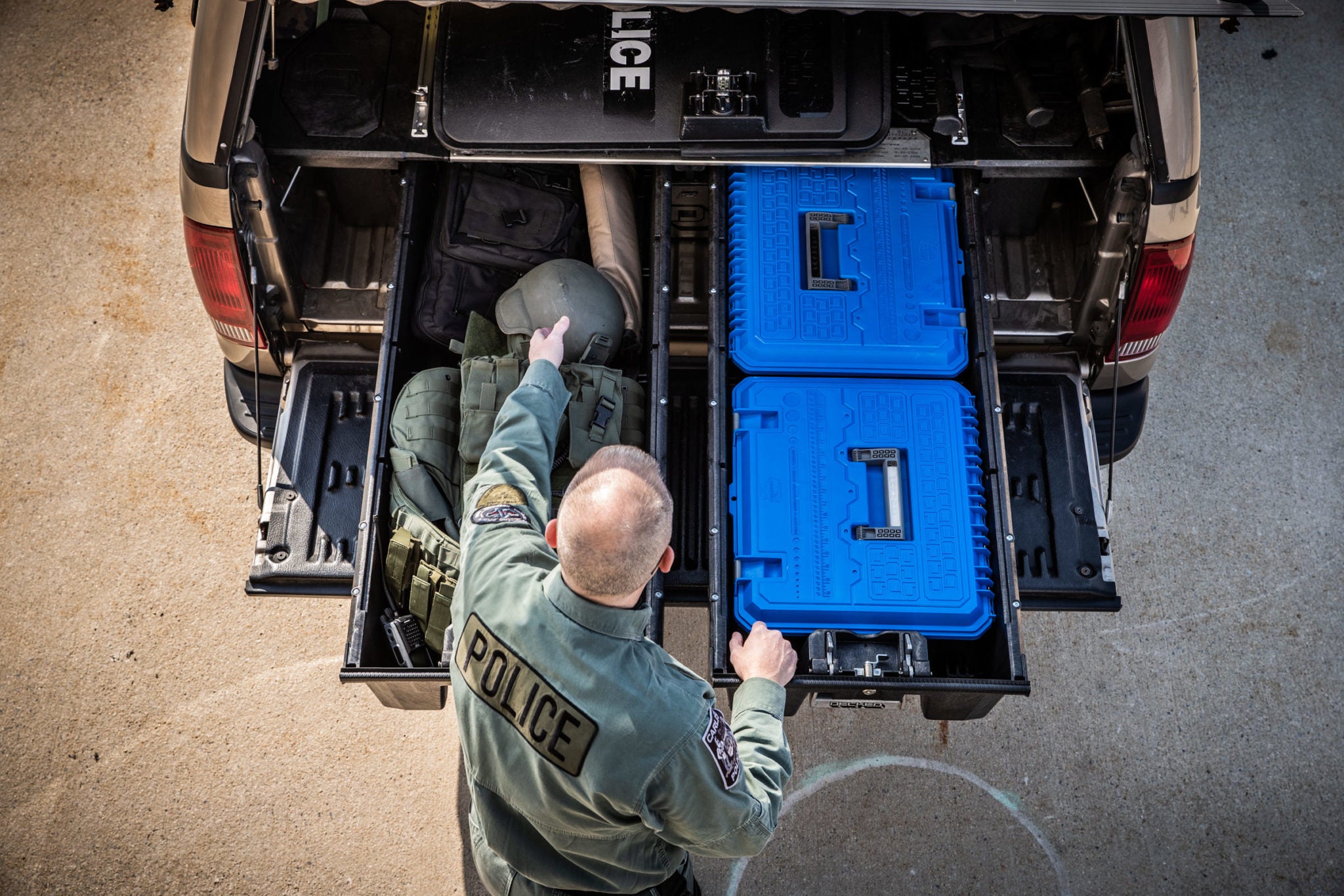 overhead view of a police officer accessing his gear in his drawer system