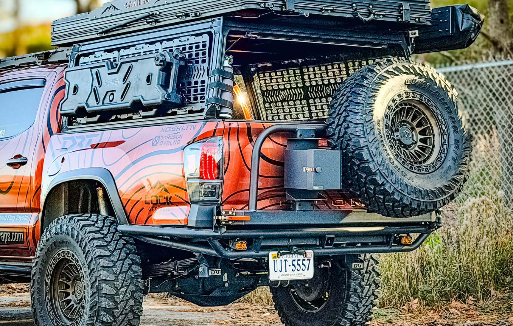 Back view of a vehicle with off-road tires and a lifted suspension, featuring a prominent 'PZ' logo.