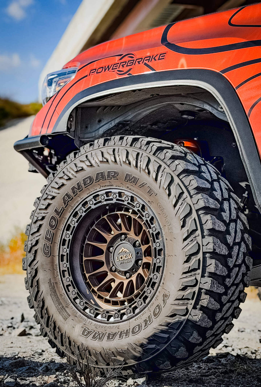 Close-up of a rugged tire on an off-road vehicle with 'PowerBrake' branding.