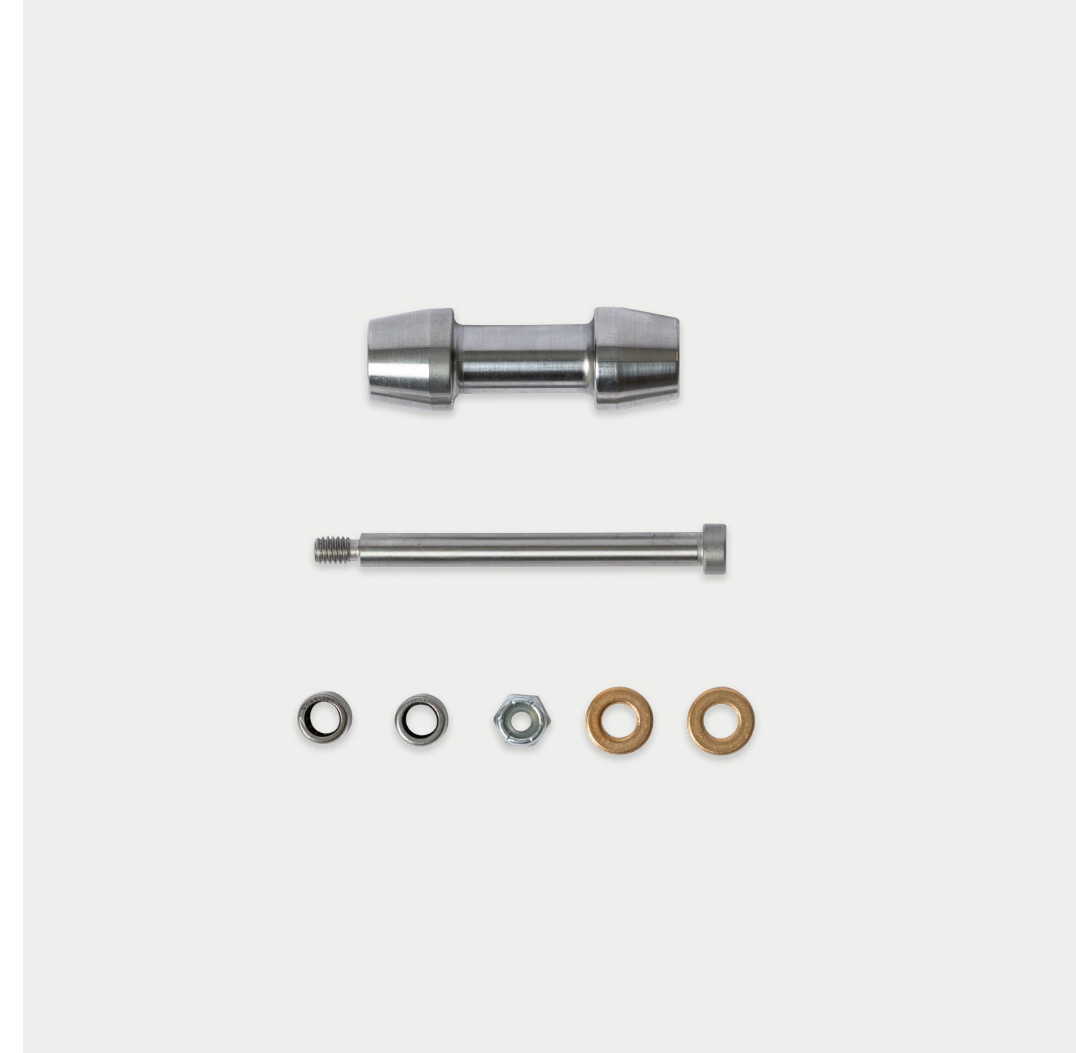 [W-DCG-600/1000-TG-ROLLER-KIT-PS-ROLLER] A metal hardware kit on a light gray background, featuring a silver metal sleeve, a long silver bolt, and small washers and nuts in silver and bronze.