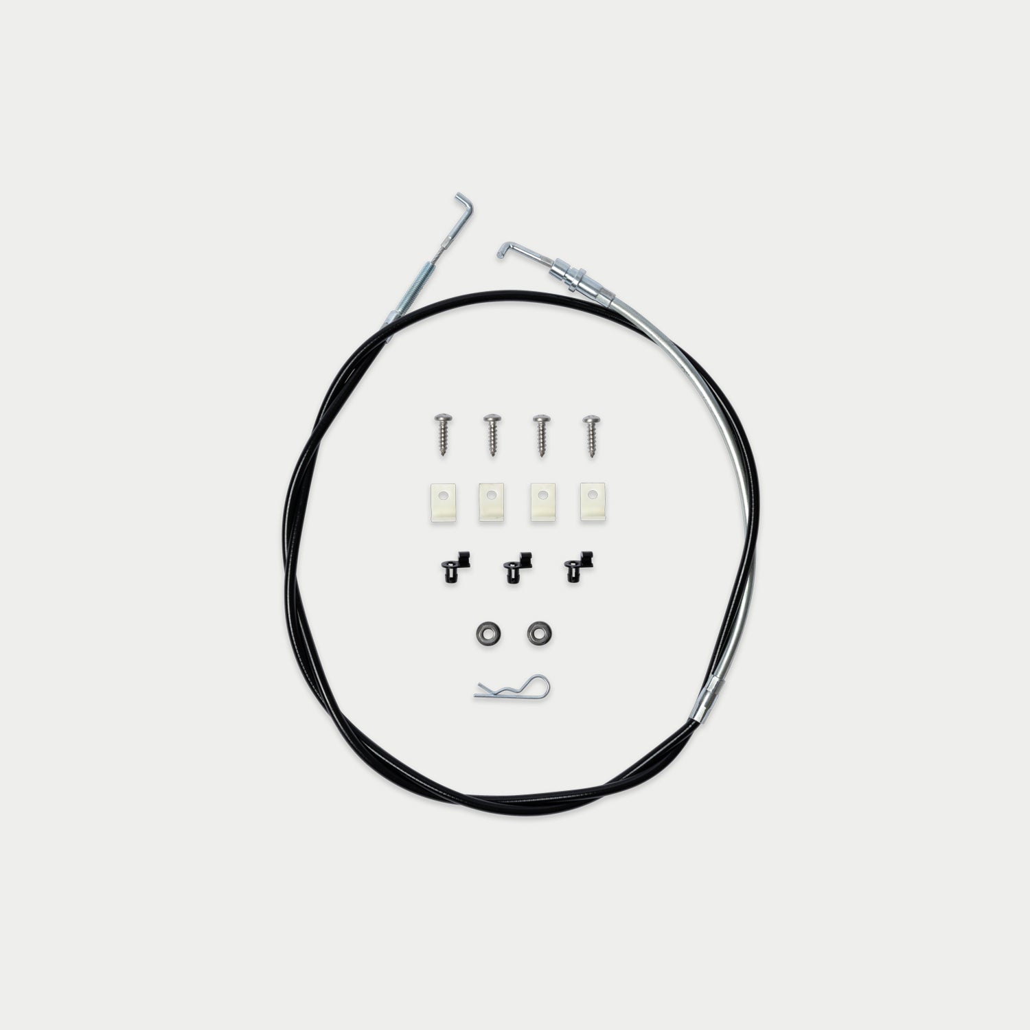 A cable assembly kit with a long black cable and several small hardware components arranged neatly on a light gray background.
