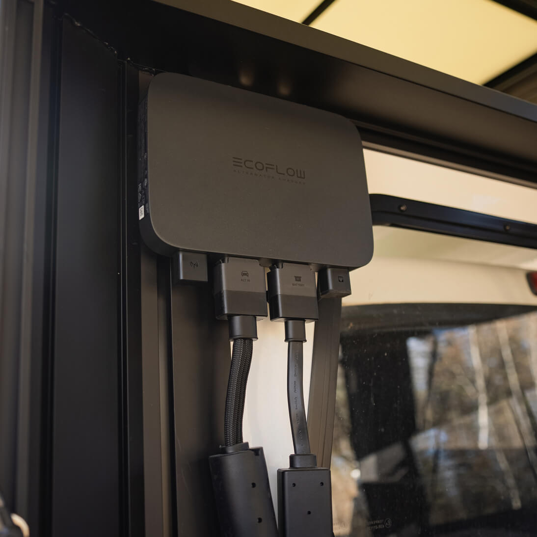 EcoFlow device with multiple USB ports attached to a vehicle's power outlet.