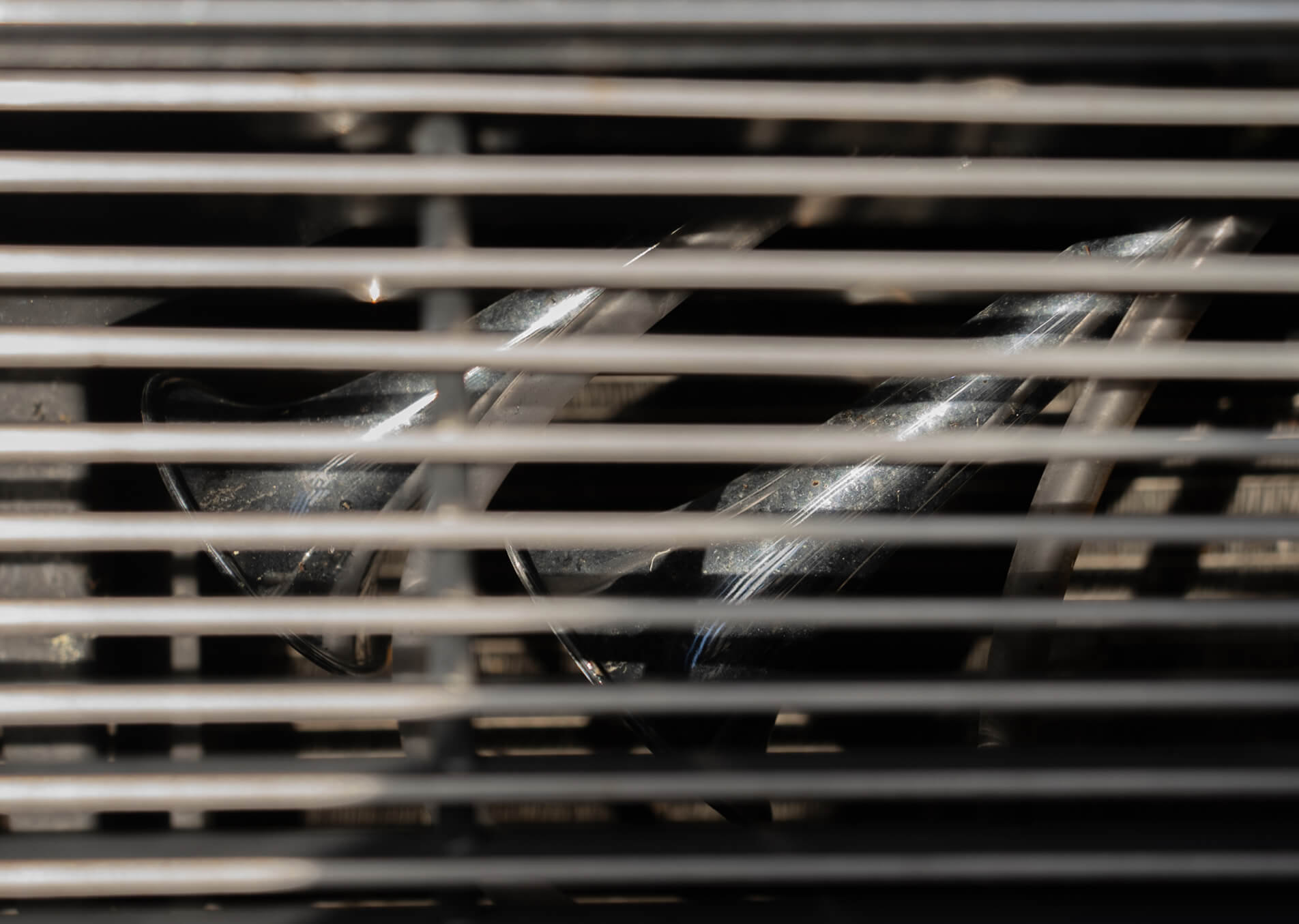 Close-up of a metal grid with a blurred background