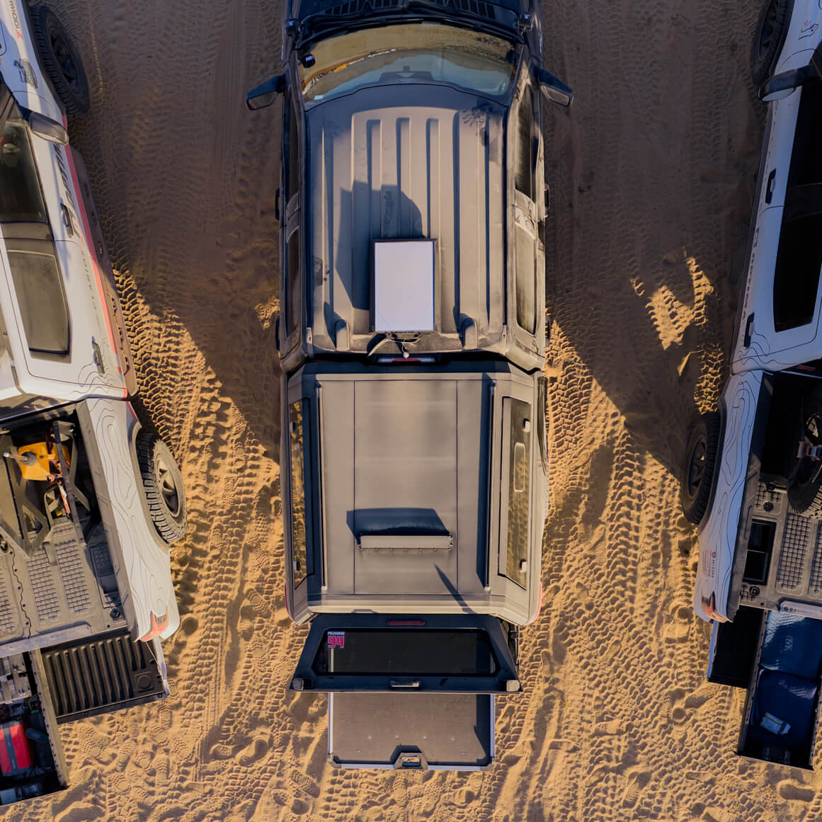 A bird's eye view of one of the Optima fleet trucks that has a CargoGlide under a cap in order to easily retrieve heavy gear from the truck's bed.