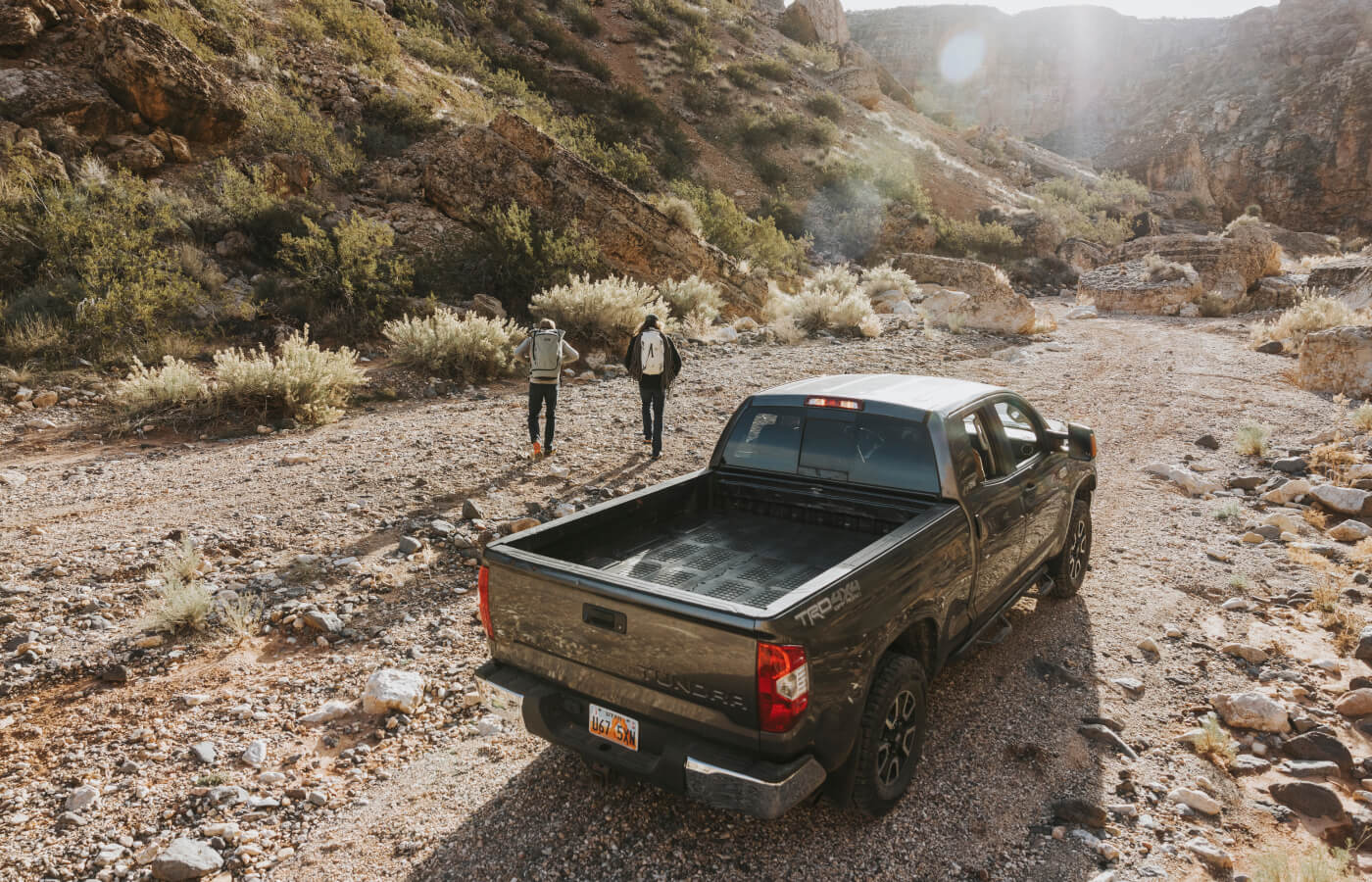 Jackson and a buddy leaving the his Tundra (equipped with a Decked Drawer System) with their climbing gear.