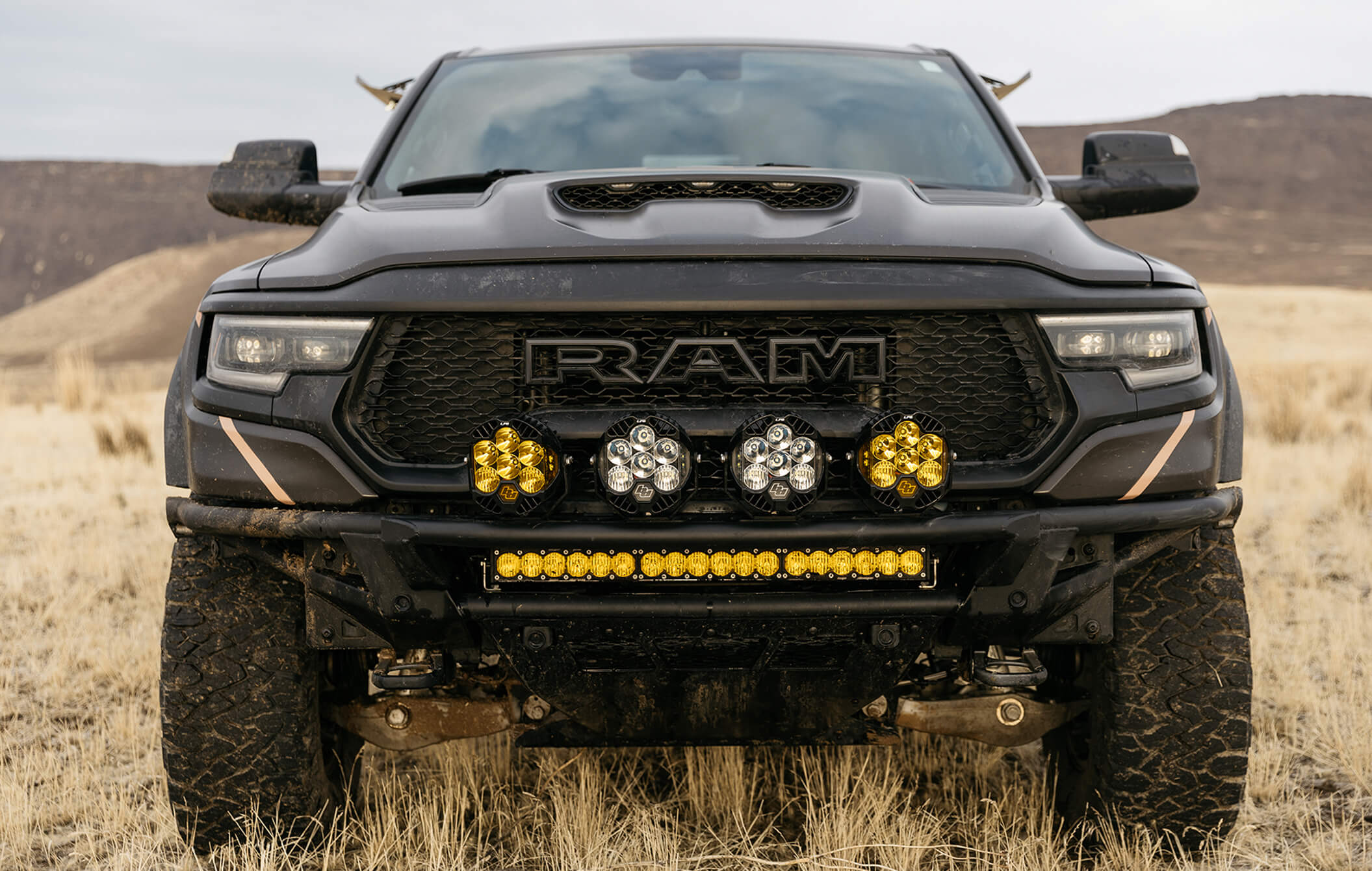 A shot of the front grill of the TRX, equipped with the Baja Designs OnX6 Light Bar.