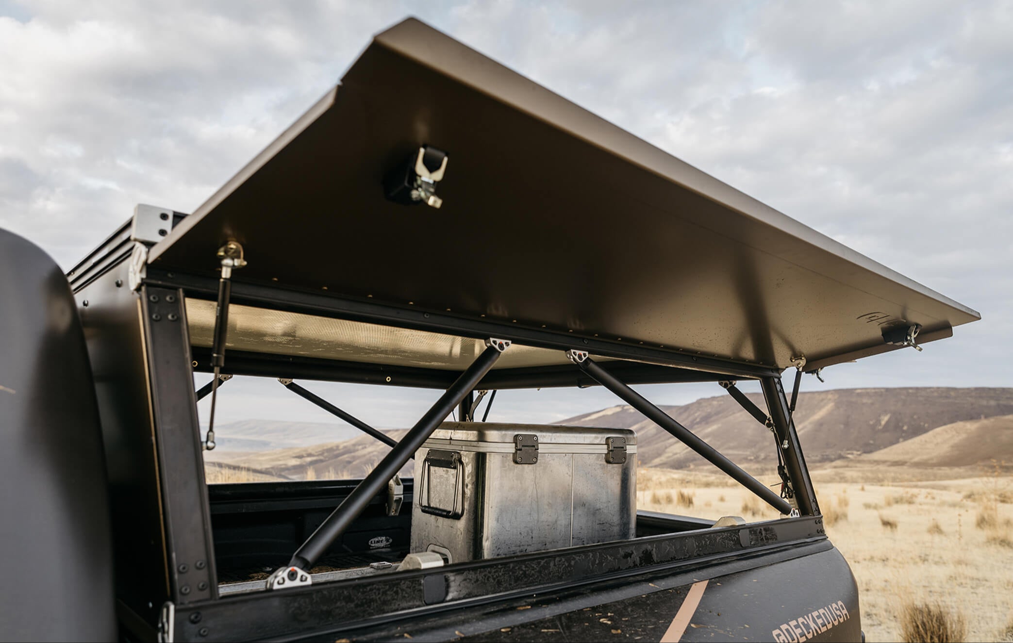 Close up of the open side windows of the GoFast Camper over the TRX's bed.