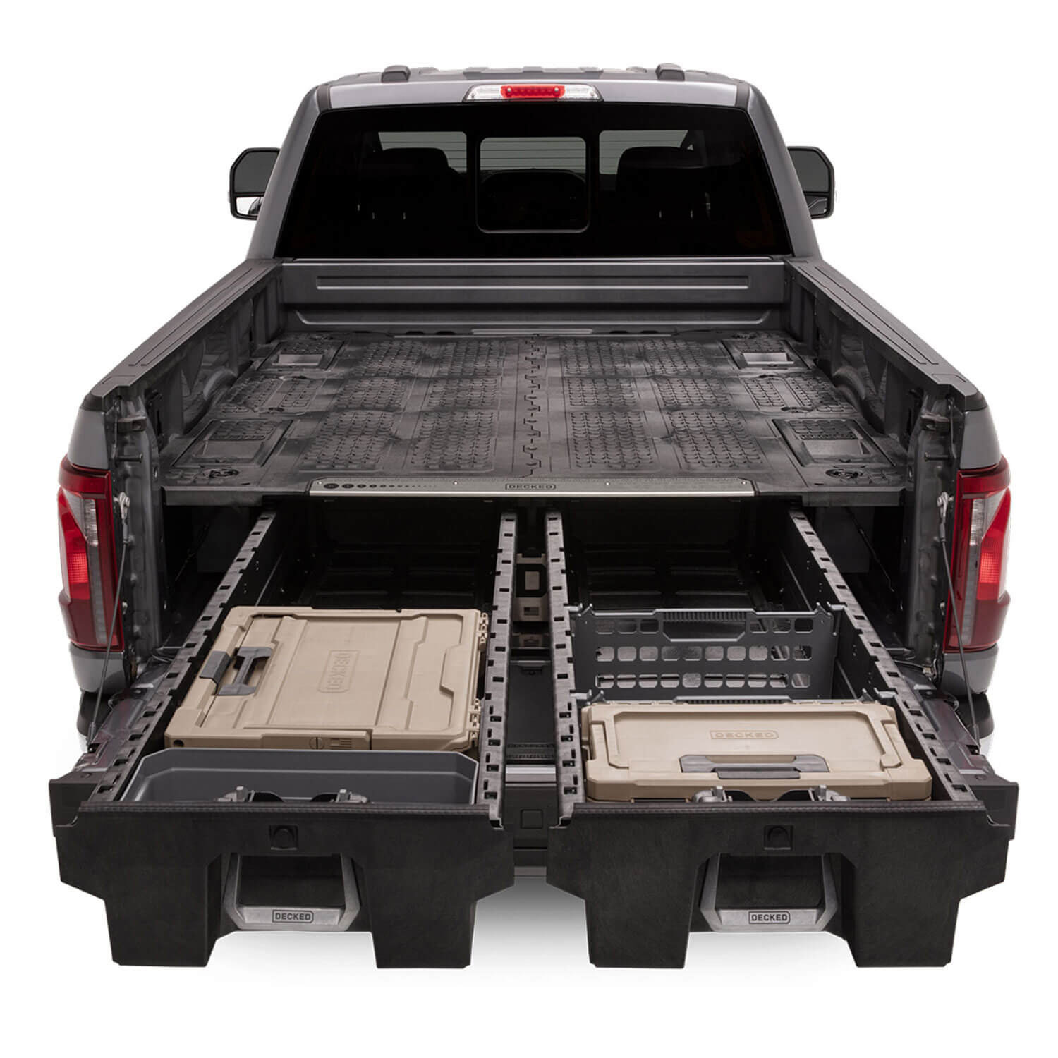 An open drawer system with 'DECKED' d-co cases and other storage options in the bed of a Ford F-150.