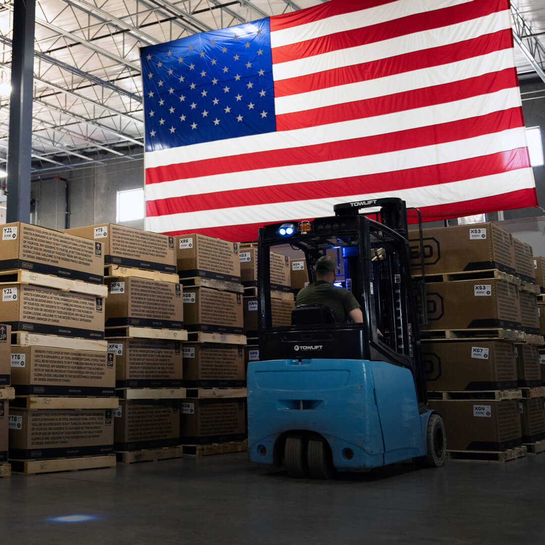 If you're reading this, you should buy American. A forklift operator moves DECKED Drawer Systems one step closer to where they belong: Your truck bed.