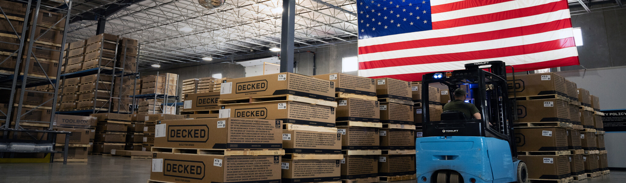 If you're reading this, you should buy American. A forklift operator moves DECKED Drawer Systems one step closer to where they belong: Your truck bed.