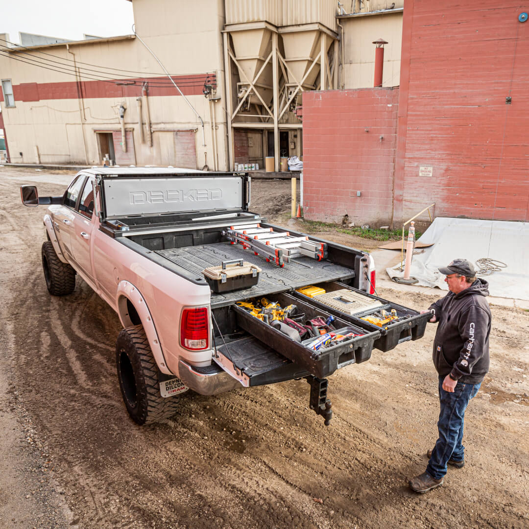 Overhead view of a Drawer System installed in an 8 foot truck with a DECKED Tool Box in the cabside gap at a construction site