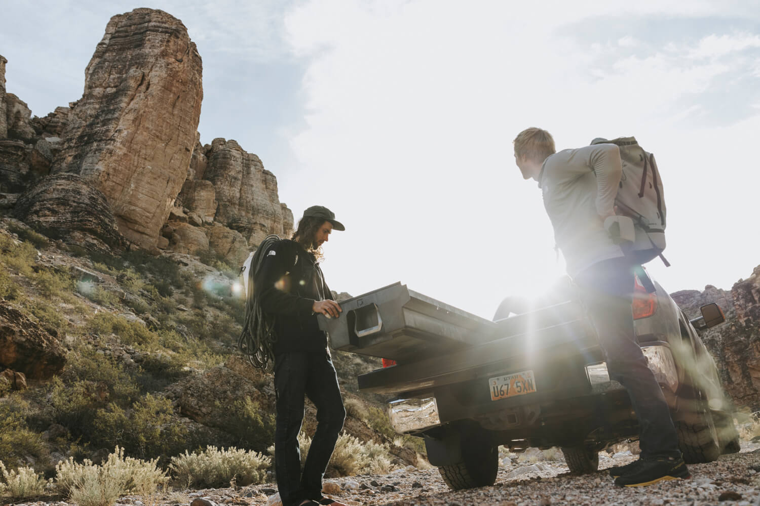 Two guys pulling climbing gear out from their Drawer System.