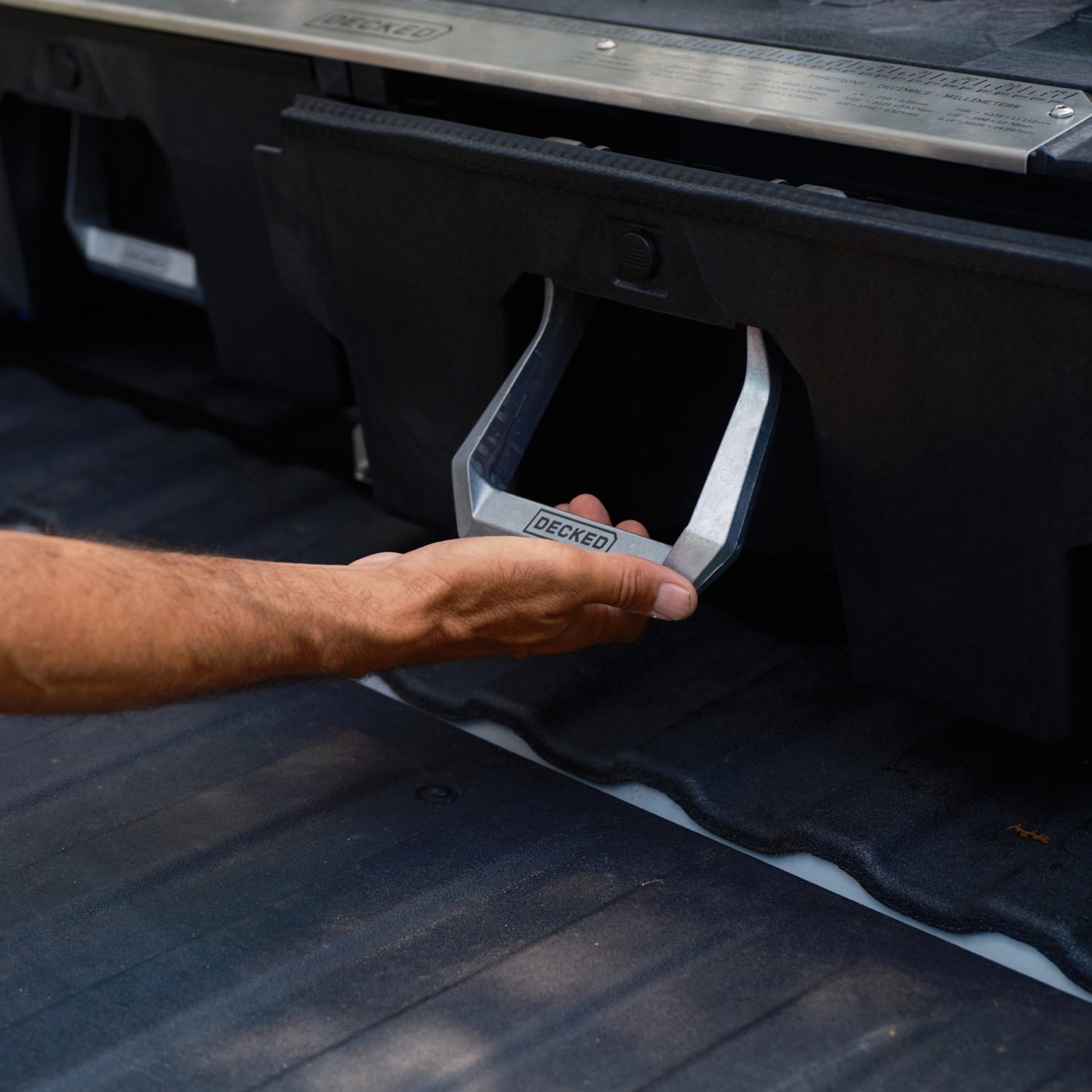 A person pulling the Drawer System handle to open the drawer.