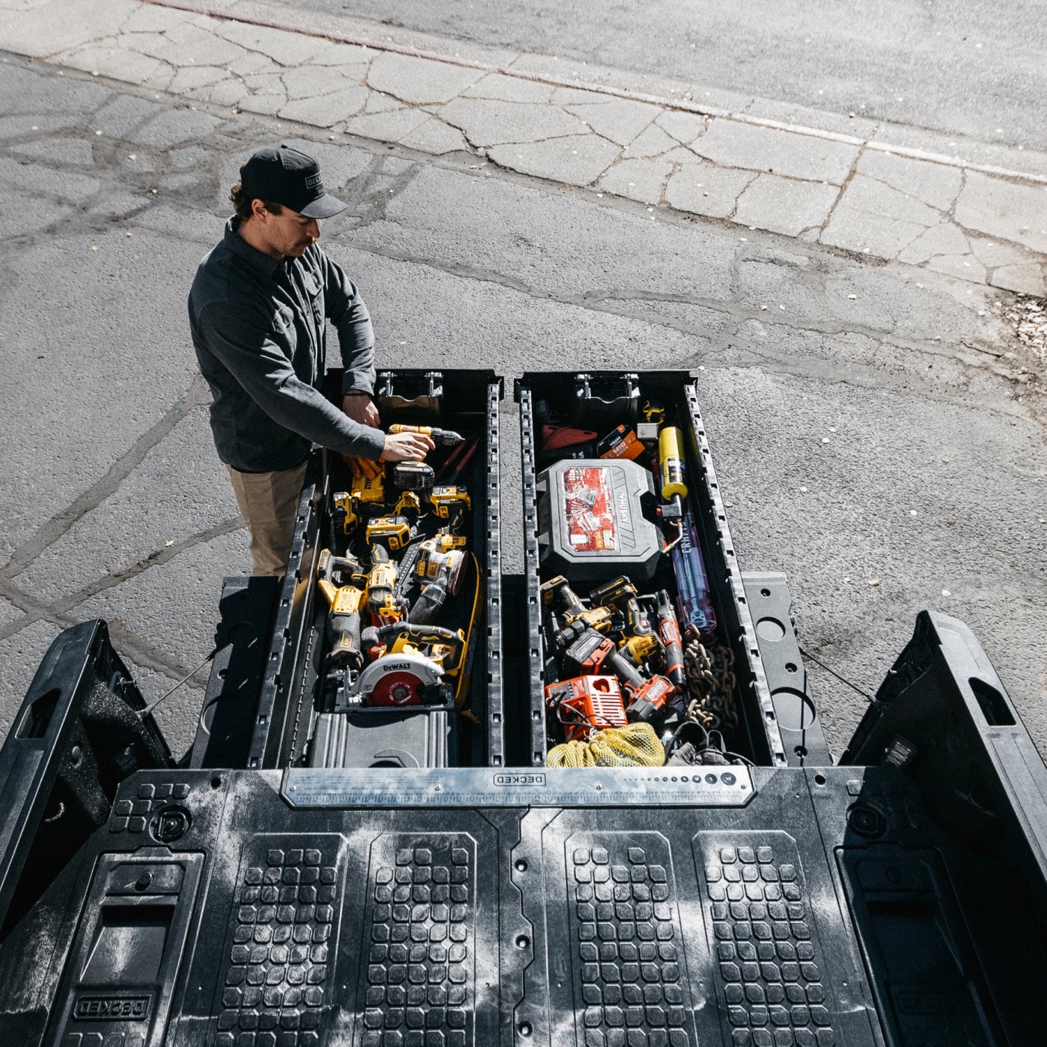 A man retrieving tools from his Drawer System.