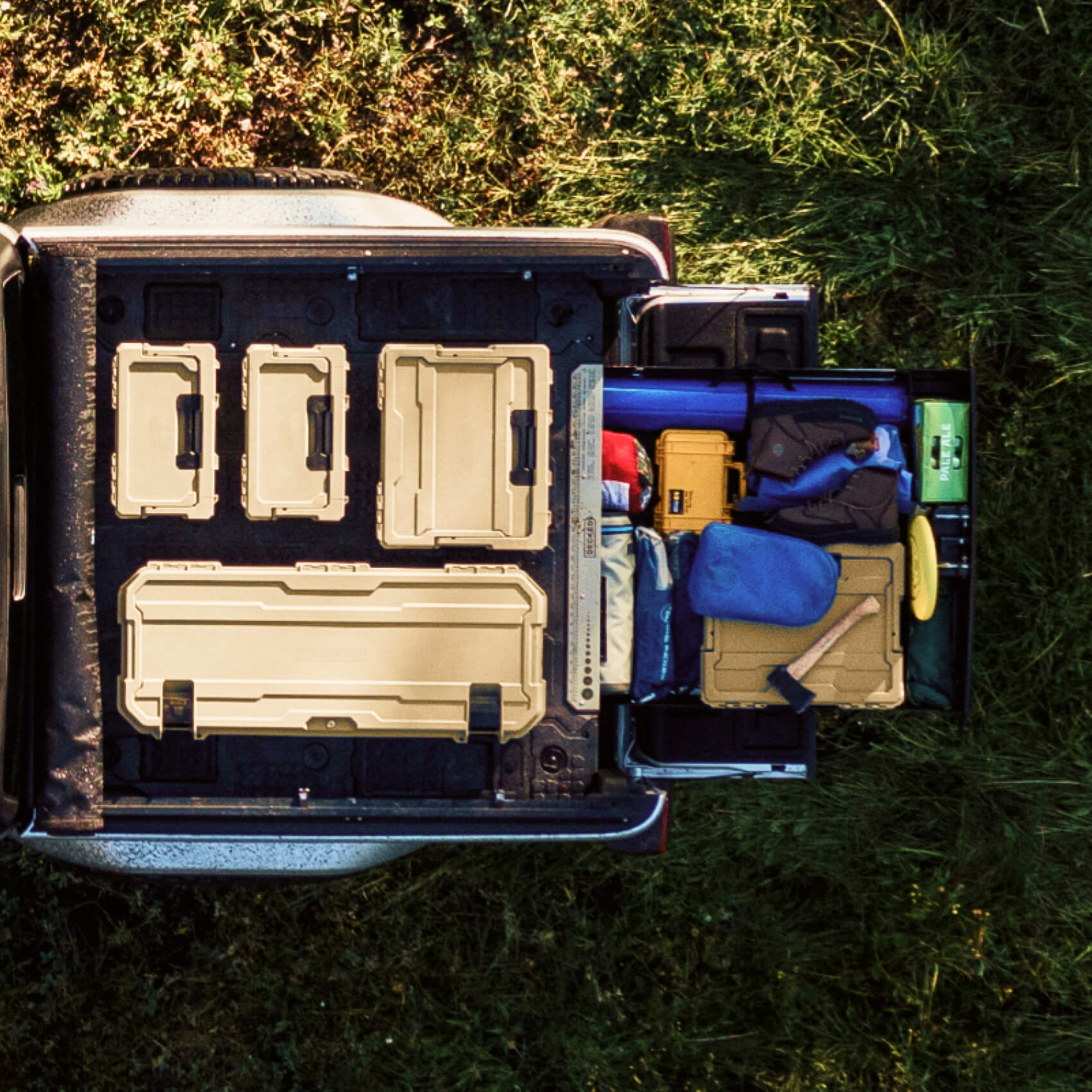 top down view of d-co cases on the back of a truck and a midsize drawer system open