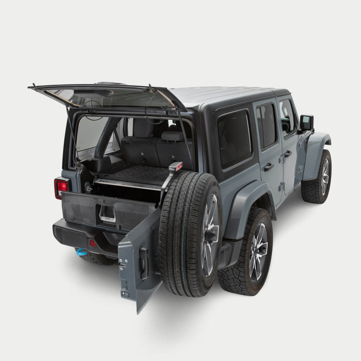 A 4-Door Jeep Wrangler on a white background with a Drawer System installed in the cargo area. The Drawer System is extended and shows the interior storage space.