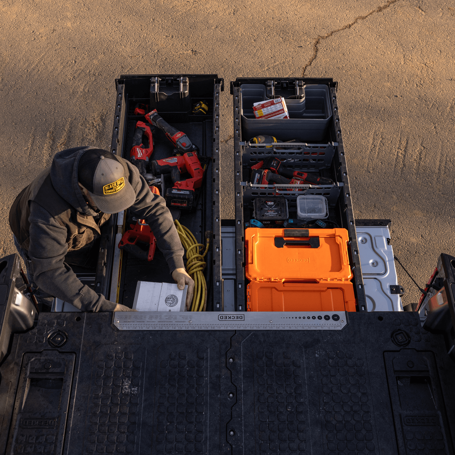 Person organizing tools in their DECKED Drawer System