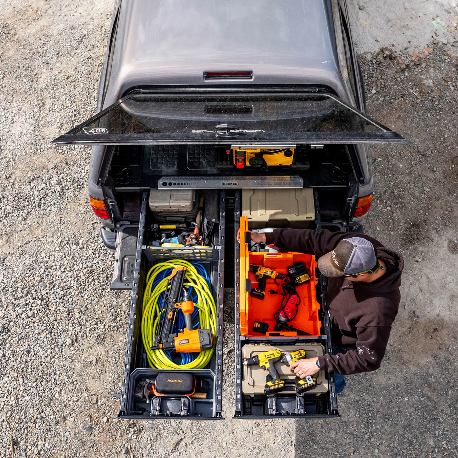 A bird's eye view of a bunch of tools and construction gear stored neatly in a tradesman's DECKED Drawer System.