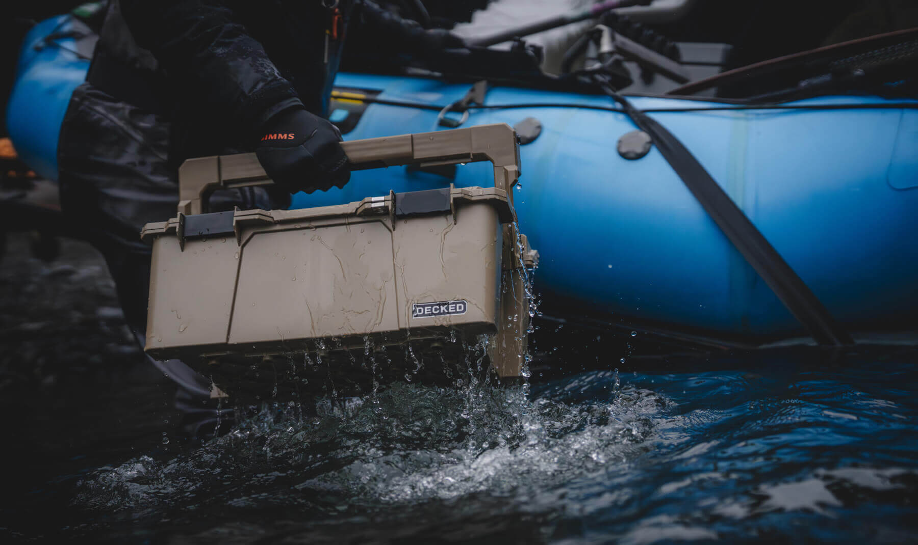 Lael Johnson carrying his Sixer D-co Case through the shallows to get to his boat.