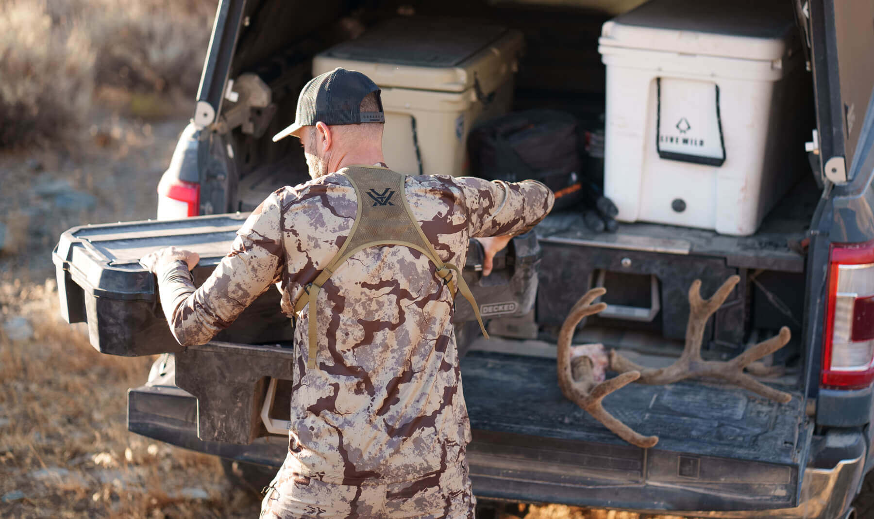 Remi Warren stowing his bow in his Decked Minuteman D-co Case.