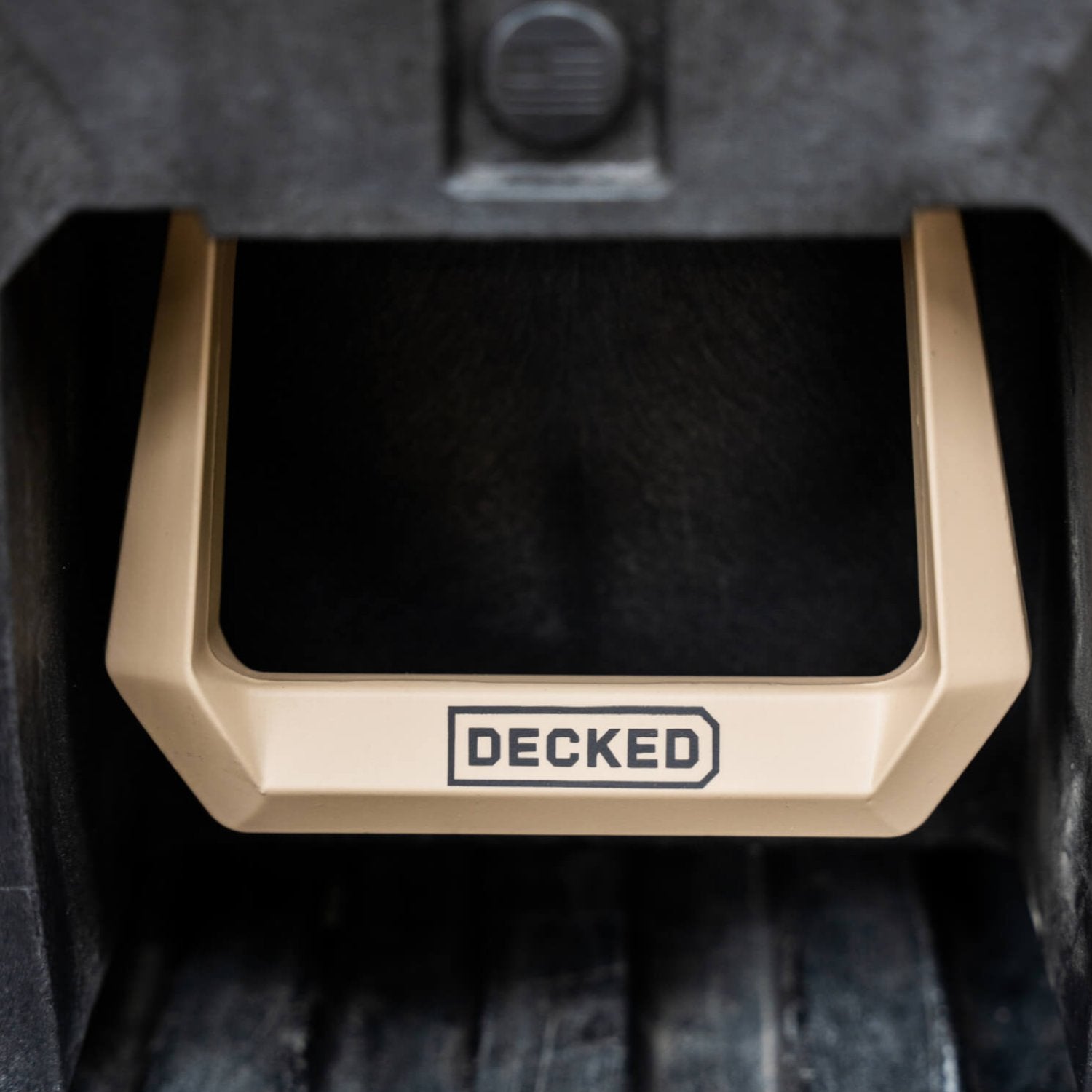 A close-up, front-on view of the Desert Tan limited edition Drawer System handle.