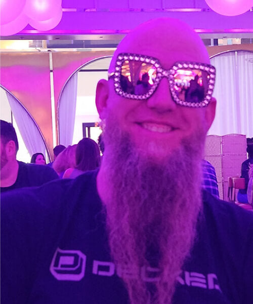 Man smiling wearing sunglasses