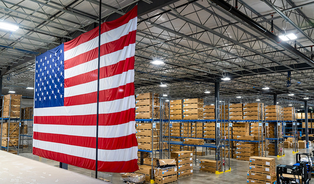 Large American flag hanging in a factory