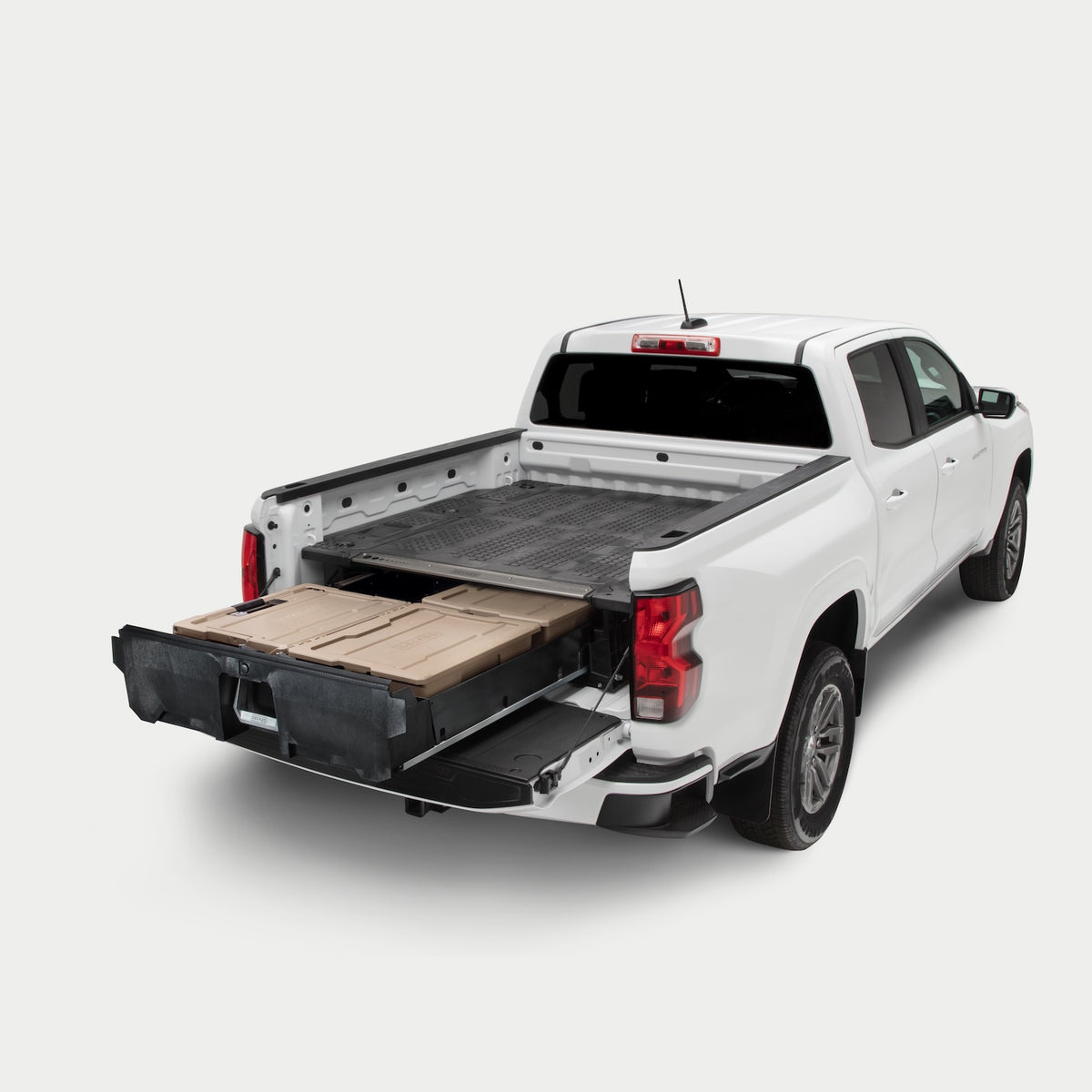 Angled image of a midsize truck with a Drawer System in the bed with its drawer fully extended.