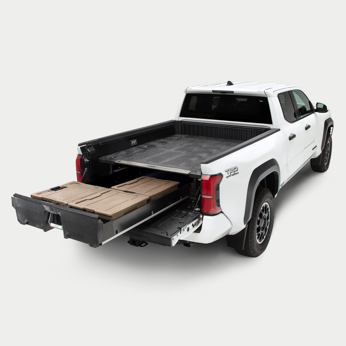Angled image of a midsize truck with a Drawer System in the bed with its drawer fully extended.