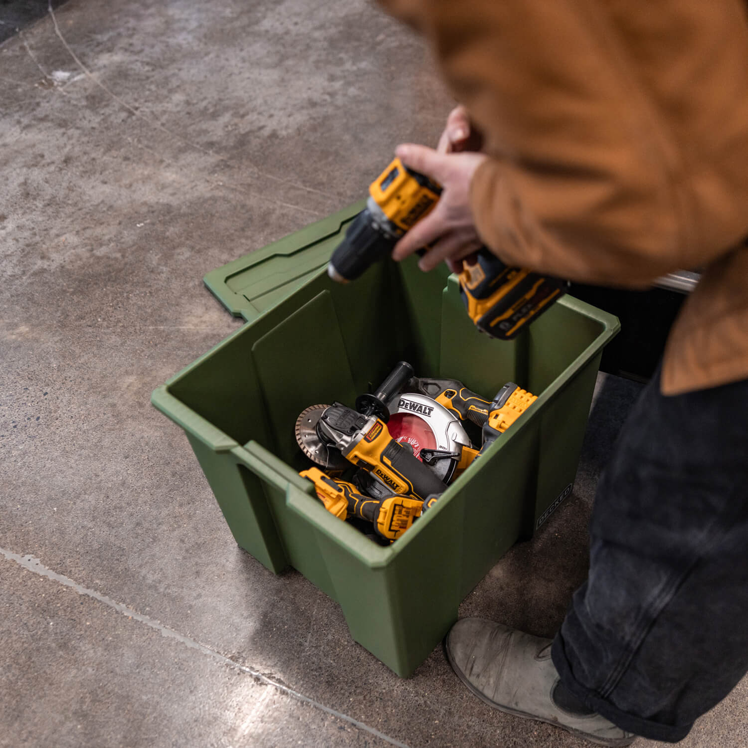 A ranger green Payloader 64 Bin loaded up with power tools and ready to be transported to the jobsite.