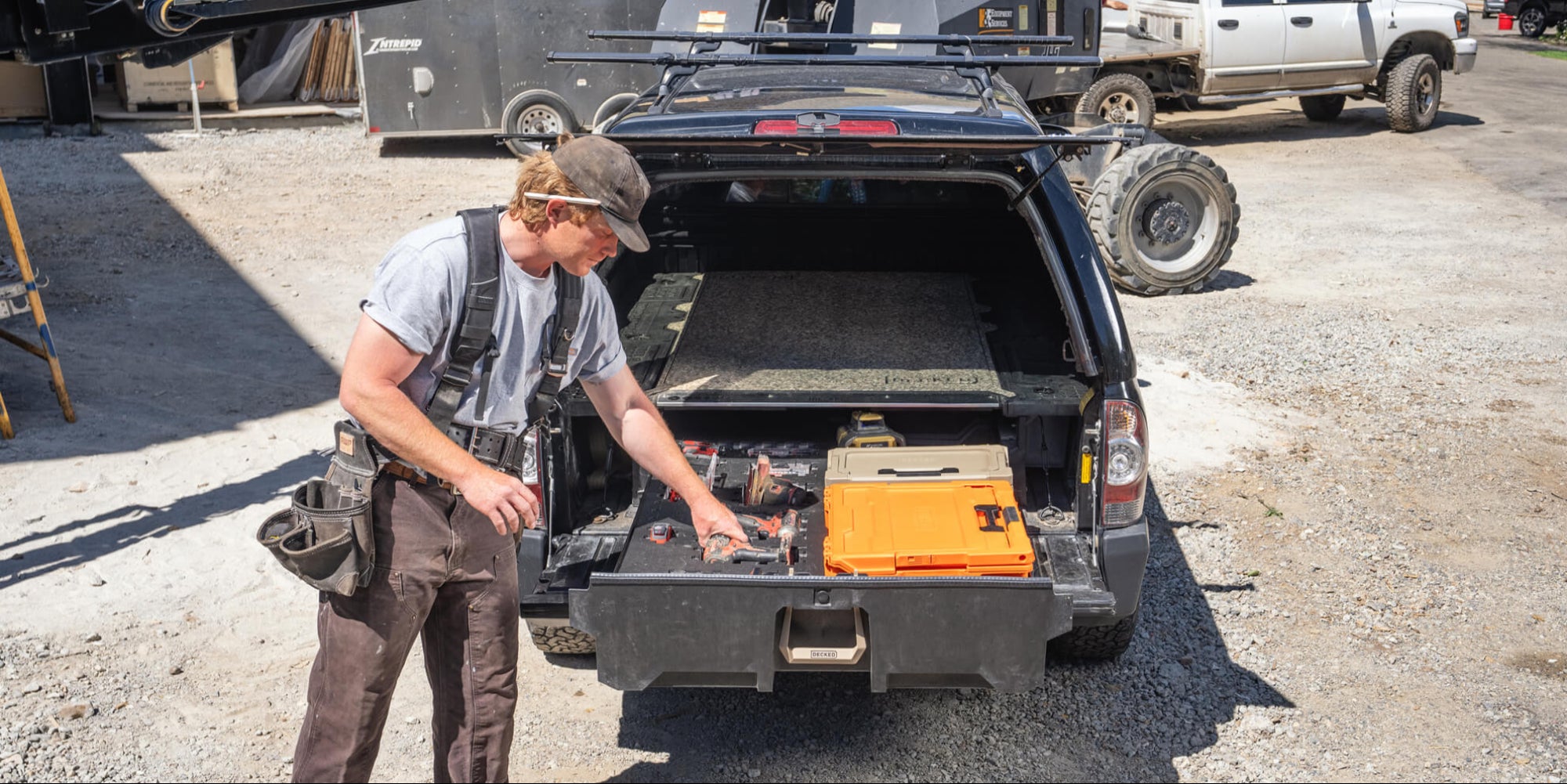 A man retrieving tools out of the Piecekeeper PuzzleFoam inside of his DECKED Drawer.