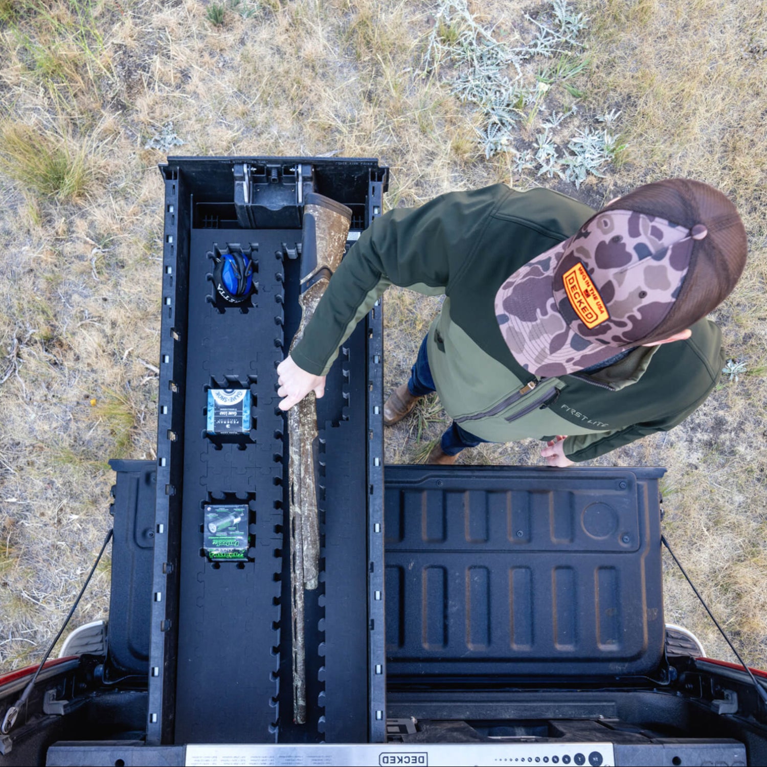 [A0151-PZFM-VXST] A man retrieving his bird hunting gear, including his shotgun and shells, out of his Drawer System's Piecekeeper PuzzleFoam organizer.