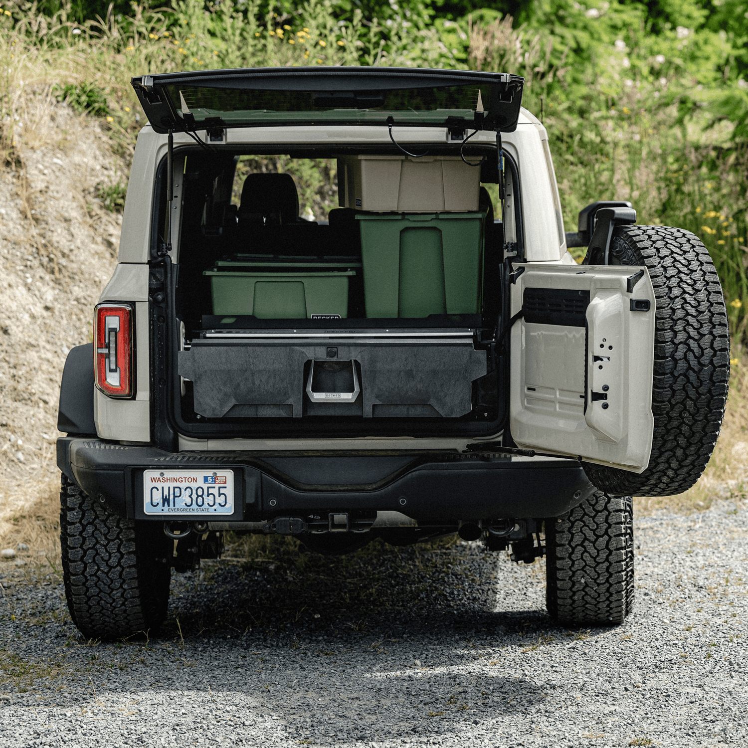 The open tailgate of a Ford Bronco with a Drawer System and DECKED bins inside.