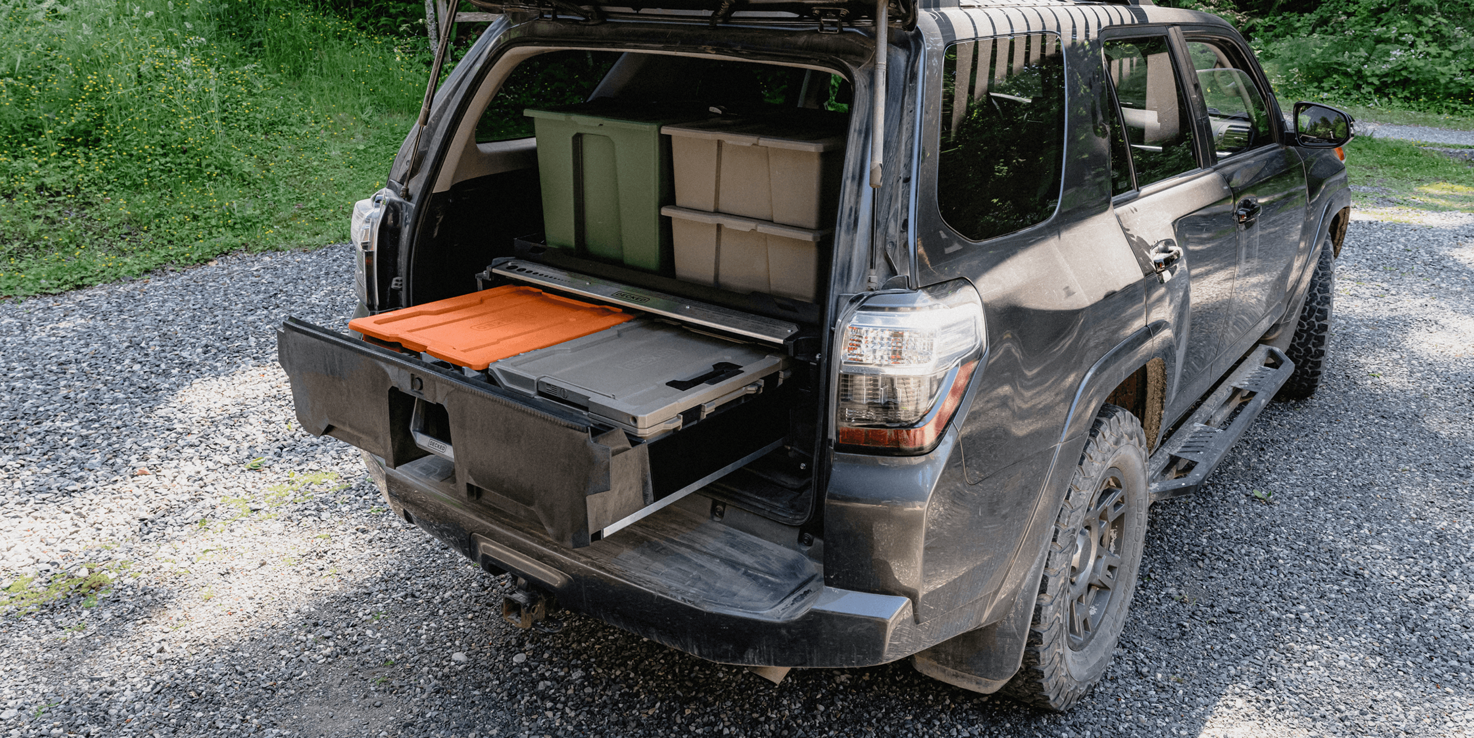 A Drawer System in the trunk of a 4Runner with DECKED bins both inside of the drawer and stacked on top of the system.