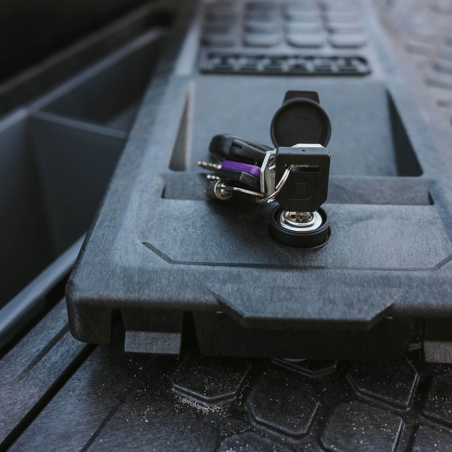 Close-up of a set of keys that unlocked a stash bin lid on a DECKED Drawer System