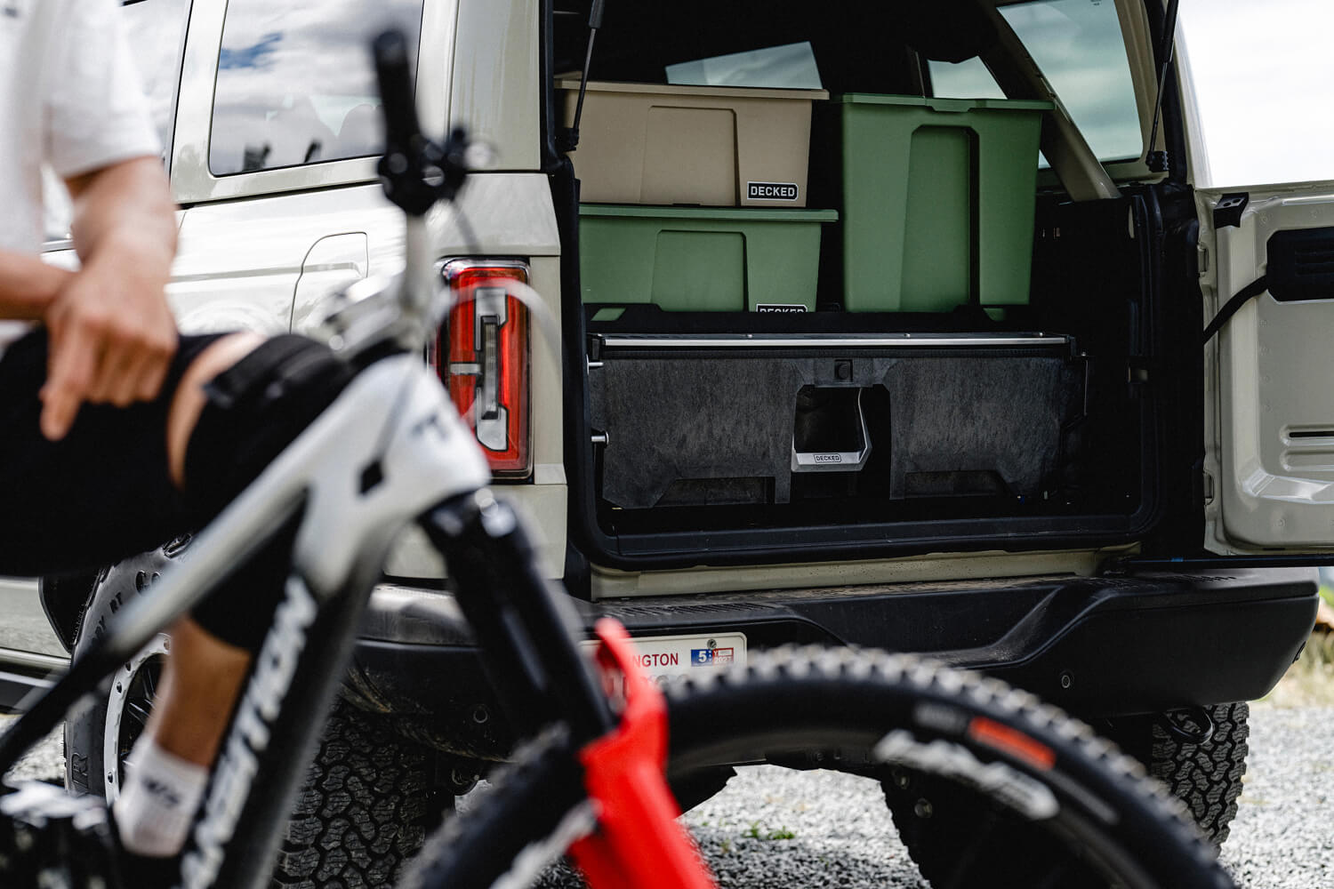 Ford Bronco with installed DECKED drawer system and cases on top.