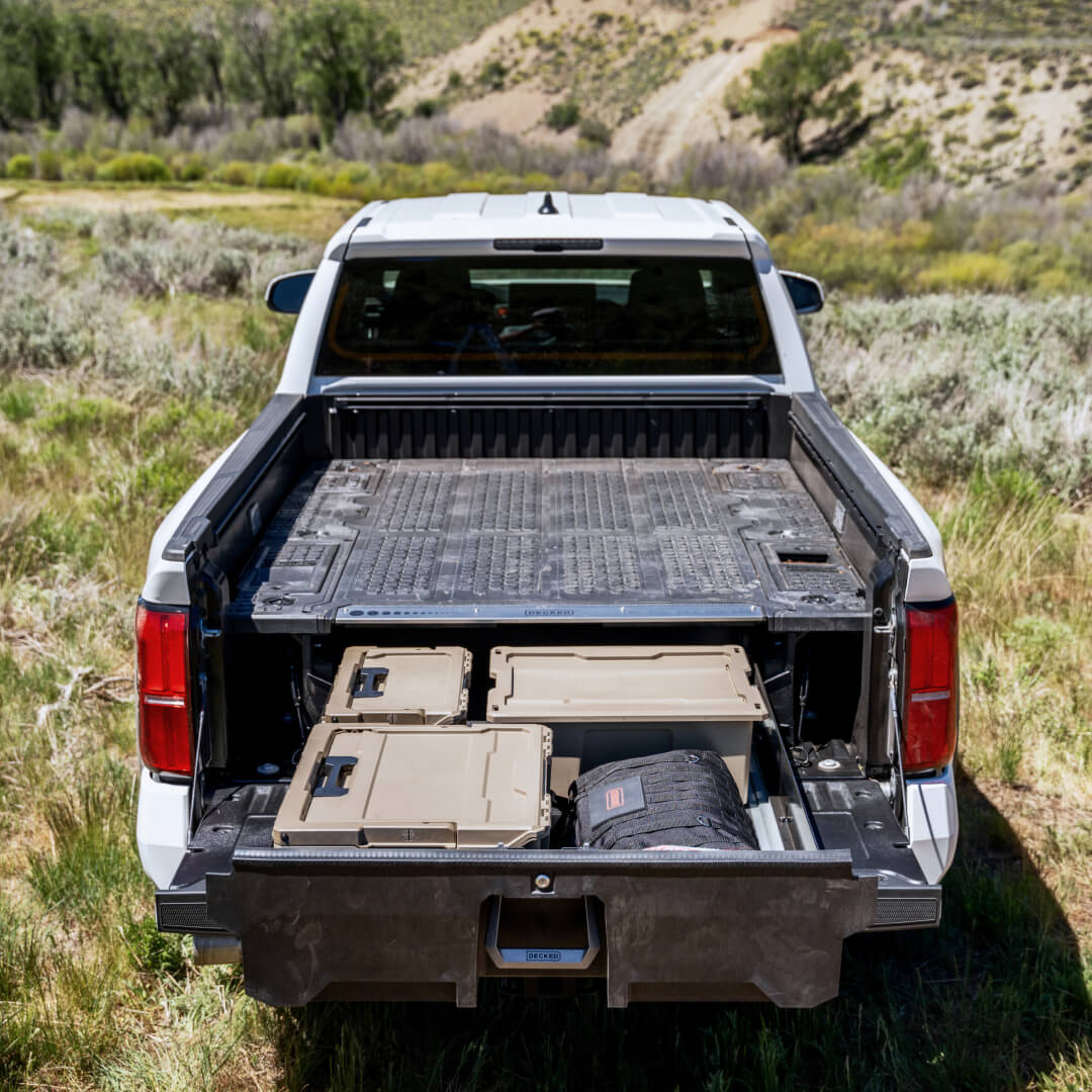 View of a Toyota Tacoma's midsize Drawer System extended to reveal three well-organized D-Co cases.