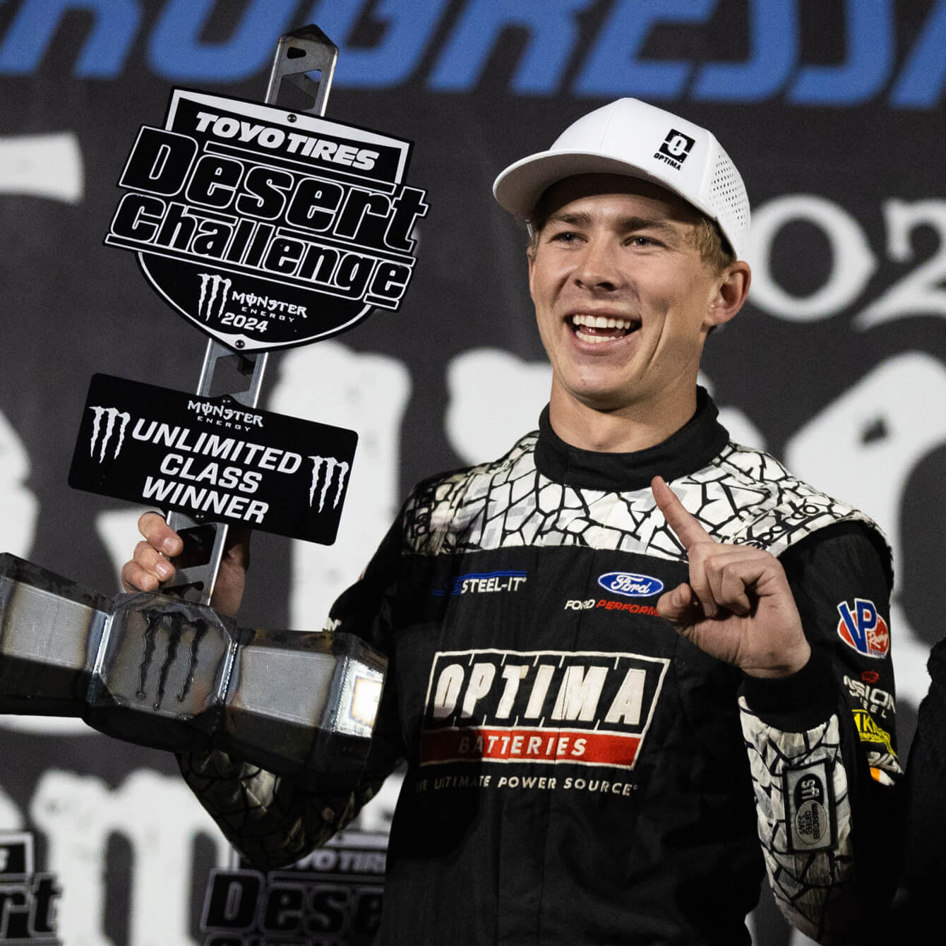 Chris Polvoorde holding his Unlimited Class trophy after the Toyo Tires Desert Challenge.