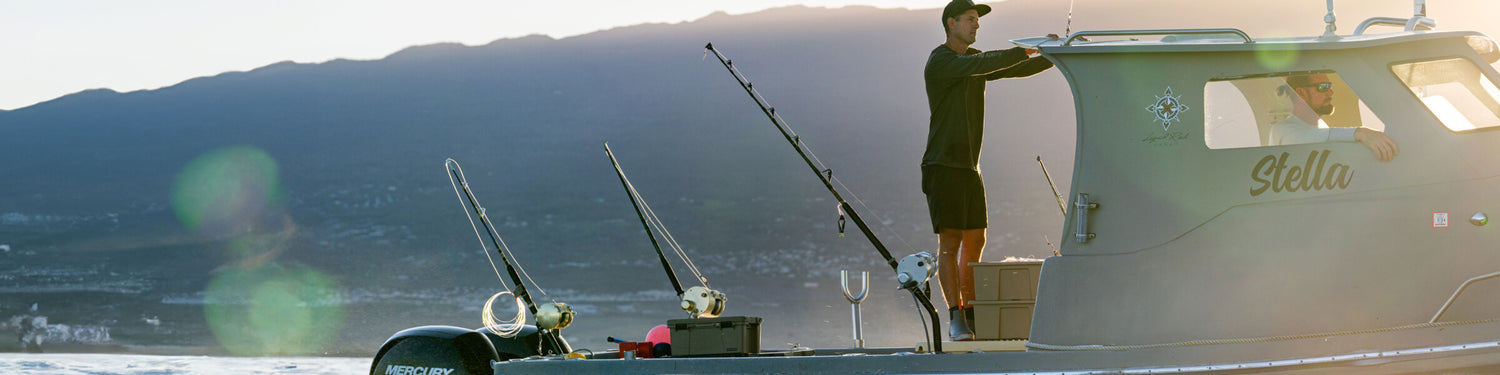 Danny Bolten standing aboard his fishing boat, the Stella with rods rigged up for a day on the water.