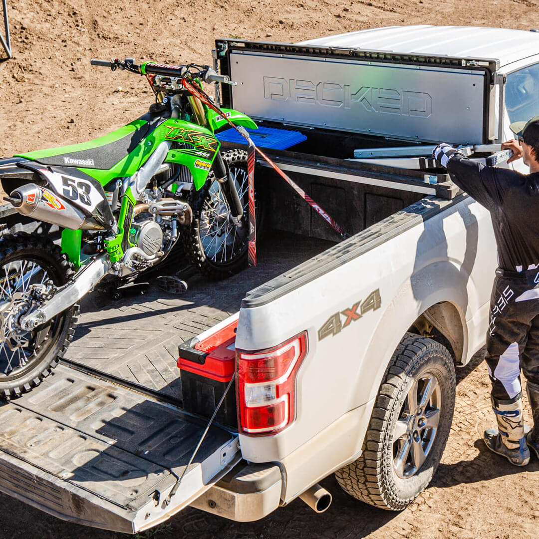 Tool Box Tie-Downs used to secure a dirt bike to the back of a truck