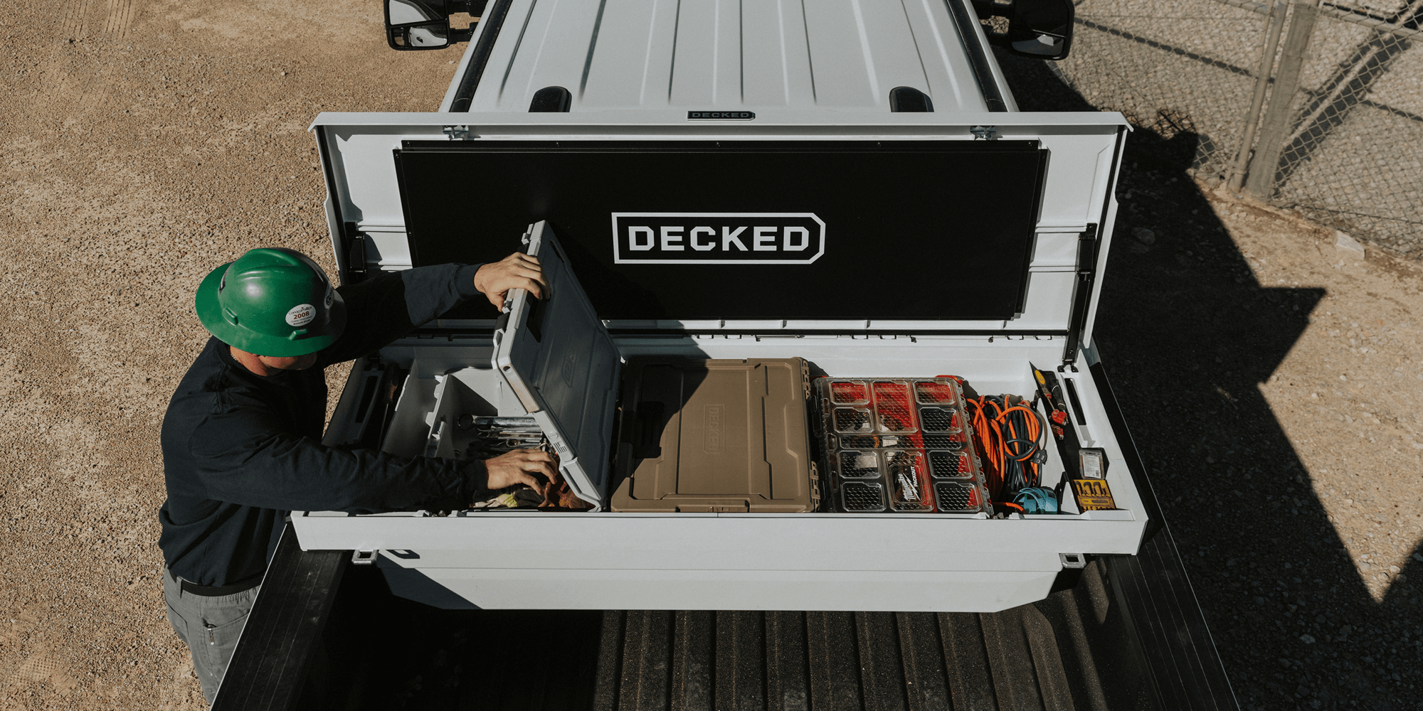 Person organizing a D-co Case nested inside of a 'DECKED' Tool Box