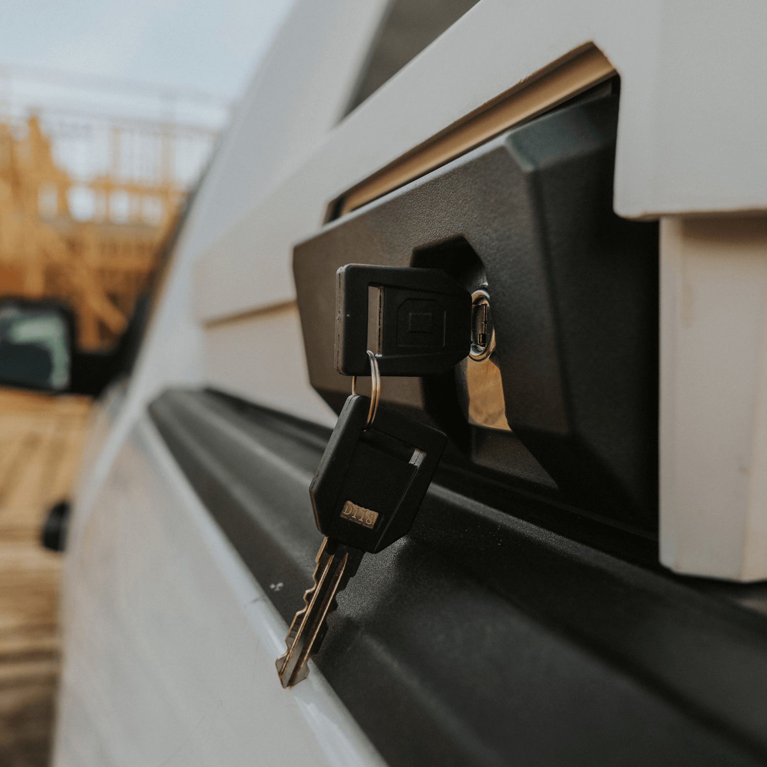 Close-up of a key inserted into a vehicle's DECKED Tool Box lock.