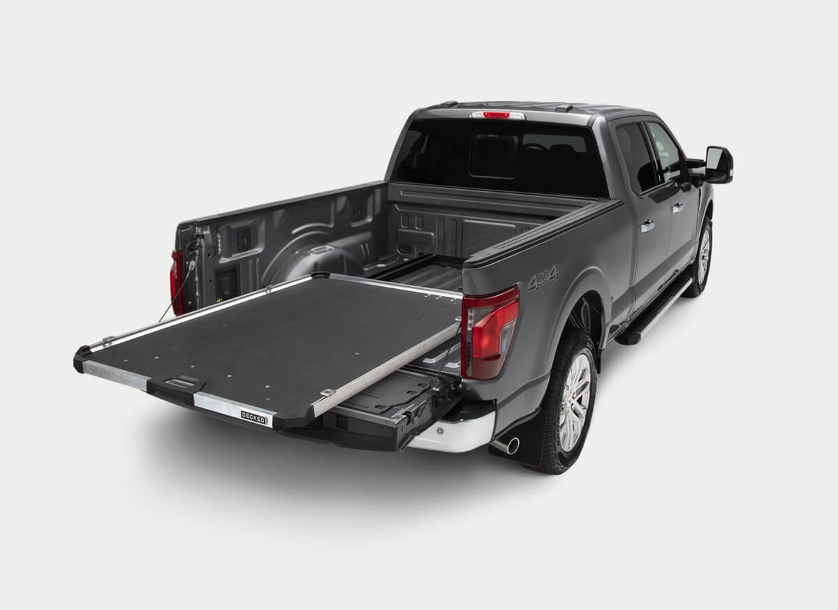 A 'DECKED' CargoGlide pulled out in the back of a Ford F-150. 