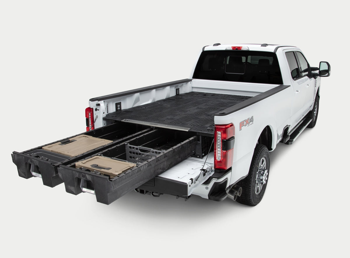 A DECKED drawer system with d-co cases in the bed of a Ford F-350. 